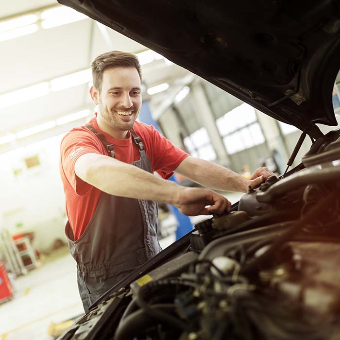 mechanic checking engine